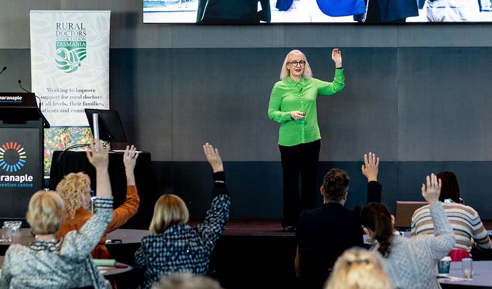 Dr Jo speaking on stage
